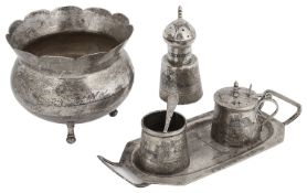 An early 20th c Iraqi silver and niello decorated three piece cruet set