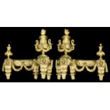 A pair of late 19th century French Louis XVI style ormolu chenets c.1900