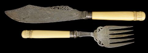 A pair of late Victorian ivory handled silver fish servers