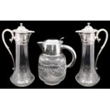 A pair of early 20th c Polish cut glass claret jugs with silver plated mounts and a lemonade jug