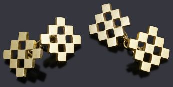 A pair of gold open chequer board chain back cufflinks