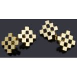 A pair of gold open chequer board chain back cufflinks