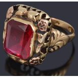 A gold single synthetic ruby stone ring