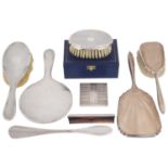 A mixed lot of silver to include dressing table sets, a compact and a boxed clothes brush and comb