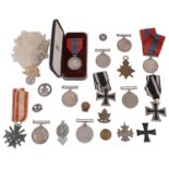 A selection of WWI and WWII medals and other related items
