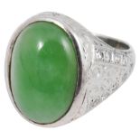 A white gold single stone jade cabochon and diamond ring