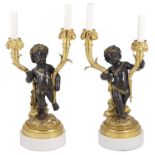 A pair of 19th century French bronze and ormolu two branch figural candelabra