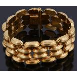 A four row hollow raised lozenge shaped panel bracelet