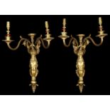 A pair of early 20th century French Empire style three light ormolu wall appliques