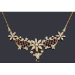 A Victorian rose gold split pearl and ruby floral centrepiece necklace