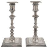 A pair of Victorian silver candlesticks in George II style