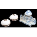 A 19th century continental faience inkwell and two Limoges egg shaped porcelain trinket boxes