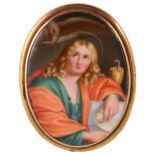 A finely painted porcelain gold framed brooch,