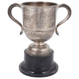 An Edwardian silver twin handled trophy cup