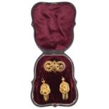 A cased Victorian gold Etruscan revival brooch and matching earring set