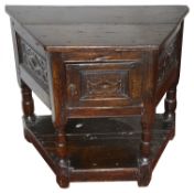 A mid 17th century oak credence table with cupboard