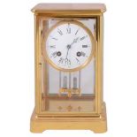 A late 19th century French gilt brass four glass mantel clock