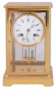 A late 19th century French gilt brass four glass mantel clock