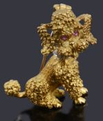 A gold gem set poodle shaped brooch