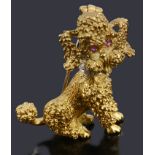 A gold gem set poodle shaped brooch