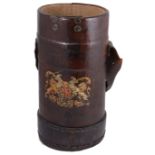 An early 20th century leather artillery shell carrier