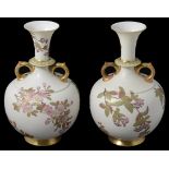 A matched pair of Royal Worcester blush Ivory twin handled vases, circa late 19th Century