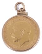 A George V half sovereign dated 1912 channel set in pendant mount