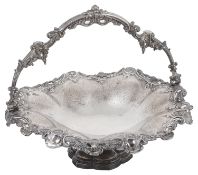 A large early Victorian silver swing handled fruit or cake basket