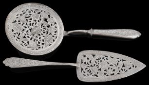 An early 20th century Persian silver serving slice and and matching skimmer