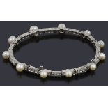 A pearl and diamond bracelet