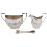 An Edwardian silver twin handled sugar bowl and milk jug
