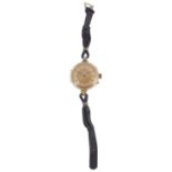 A Continental gold open faced fob watch converted to a wristwatch,