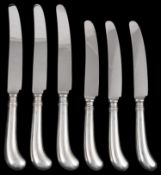 A set of twelve contemporary silver pistol grip handled table and dessert knives