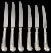 A set of twelve silver handled leaf capped pistol grip table and dessert knives