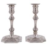 A pair of George V silver candlesticks in George I style