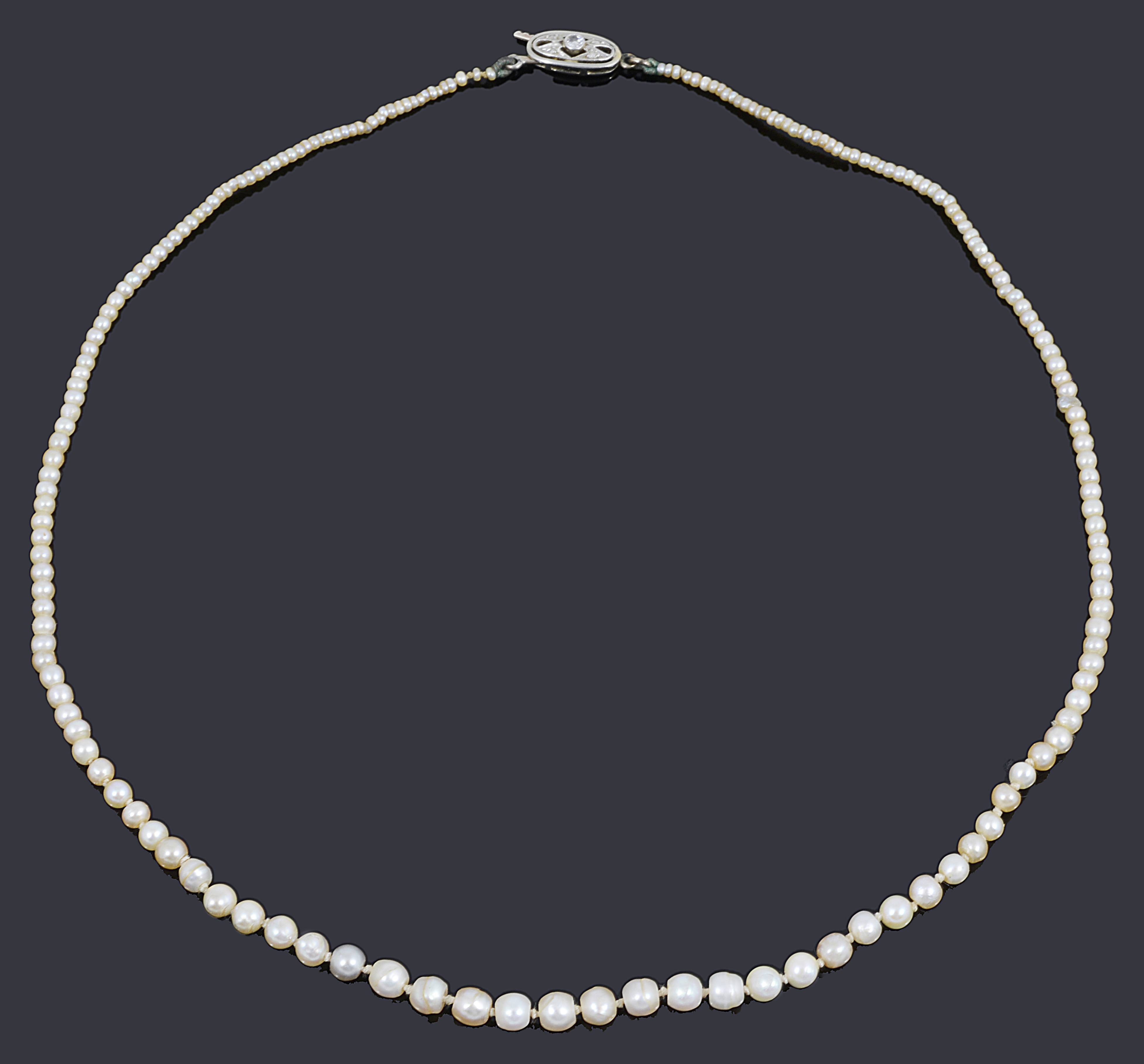 A single row natural and cultured pearl necklace