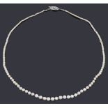 A single row natural and cultured pearl necklace