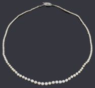 A single row natural and cultured pearl necklace