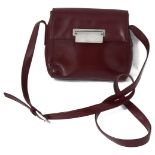 A vintage Prada red leather handbag