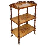 A Victorian figured walnut and marquetry inlaid three tier whatnot