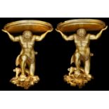 A large pair of 19th century carved giltwood figural wall brackets