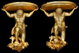 A large pair of 19th century carved giltwood figural wall brackets