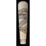 A late 19th century Japanese Meiji Period carved ivory walking stick or umbrella handle