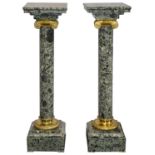 A pair of 19th century French style ormolu mounted green marble columns