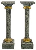 A pair of 19th century French style ormolu mounted green marble columns