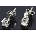 A pair of 9ct white gold diamond stud earrings