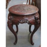 HEAVILY CARVED ORIENTAL STYLE CIRCULAR OCCASIONAL TABLE WITH PIERCEWORK DECORATION