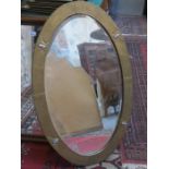 ART NOUVEAU HAMMERED BRASS OVAL BEVELLED WALL MIRROR WITH RUSKIN STYLE MOUNTS