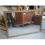 GILDED AND BEVELLED WALL MIRROR,