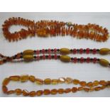 THREE STRANDS OF AMBER BEADS